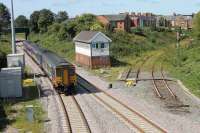 A Preston to Blackpool North service passes the old junction for Fleetwood as it leaves Poulton on 26th Augst 2017. The signallers have put a board in the window of Poulton No.3 box displaying <I>1896 - 2017</I>  for its final summer of operation. <br><br>[Mark Bartlett 26/08/2017]