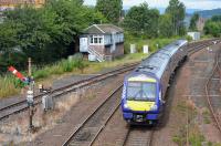 170394 enters Stirling, passing the North signalbox and the Down home signal on 23rd August 2017. This and the Down starter are the last semaphore signals in the station area.<br>
<br>
<br><br>[Bill Roberton 25/08/2017]