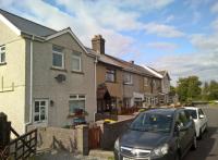 The station may have been demolished to make way for the Heads Of Valleys road, but the station cottages live on. The larger house on the left was allocated to the station master; while the Eastern end of the Abergavenny platform corresponds to the grassed area around the white car just visible in the right of this photograph. A resident assured me that the cottages were very well built. [see also image 60980]<br><br>[Ken Strachan 19/08/2017]