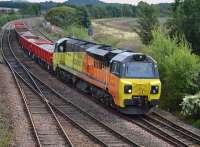 Who says railways today are dull?  Colas 70804 and Montrose - Millerhill ballast train provide a splash of colour passing Inverkeithing East Junction.<br><br>[Bill Roberton 27/08/2017]