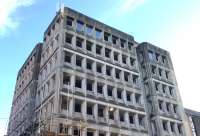 The forlorn looking Consort House (at the southwest corner of Glasgow Queen Street station site) which has now been internally stripped and has had most of its windows removed. The scaffolding will be extended to enable floor by floor demolition.<br><br>[Colin McDonald 11/09/2017]