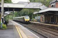 The beautiful station at Poynton is passed by an Arriva XC Voyager on 03 September 2017 en-route to Bournemouth from Manchester.<br><br>[John McIntyre 03/09/2017]