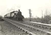 A Balloch - Rutherglen train passing Dumbuck on 12 April 1958 behind Stanier 2--6-2T 40189. <br><br>[G H Robin collection by courtesy of the Mitchell Library, Glasgow 12/04/1958]