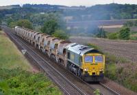 66549 leads a Millerhill - Dyce ballast away from Inverkeithing East Junction, with 66956 on the rear.<br><br>[Bill Roberton 09/09/2017]