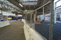 Northern services between Blackpool and Manchester via Bolton have been replaced by buses for engineering work at Bolton station since 12 August and should have returned to normal on 28 August 2017. Unfortunately a burst water main at Moses Gate damaged an overbridge and surrounding earthworks delaying the re-opening. On 05 September 2017 Northern were able to operate a limited shuttle service between Blackpool and Bolton prior to the line being re-opened throughout on 06 September 2017. In this view southwards, a pair of Class 150s wait to head back to Blackpool from platform 4. On the right behind the barrier, the 'new' platform 5 continues to take shape with track and signalling in place.<br><br>[John McIntyre 05/09/2017]