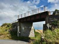 Half a mile to the east of Strichen the railway crosses a minor road. The bridge looks quite precarious but at least it survived unlike many on the route. This is now part of the Formartine and Buchan Way.<br><br>[Alan Cormack 15/08/2017]