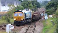 GBRf 66709 takes the Millerhill route at Niddrie West Junction on 10 September 2017 with a trainload of spent ballast. The locomotive is in 'MSC Sorrento' promotional livery. Note the new housing development now occupying the site of Niddrie Yard [see image 4546].<br><br>[John Furnevel 10/09/2017]