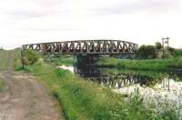 Approaching Orchardhall Swing Bridge on the towpath alongside the Forth and Clyde Canal in 1995. View is east towards Grangemouth. This section of Falkirk's Bainsford branch closed in 1991 and a bridge carrying the M9 motorway now crosses the canal at this point. <br><br>[James C Wilson Collection //1995]