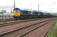 DRS 66431 and two friends waiting to leave Millerhill sidings on the morning of 24 September 2017 with an empty ballast train. The stabling and cleaning roads of the under construction EGIP electric train depot stand in the background, with new track panels stacked beyond.<br><br>[John Furnevel 24/09/2017]