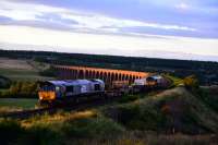 The Late evening sun lights up 66302 and 66301 *Kingmoor TMD* as they<br>
leave Inverness for Carlisle with the Flask special. 66301 has taken over<br>
the name * Kingmoor TMD * from 37688 which has entered preservation at the<br>
Mid Norfolk Railway.<br><br>[John Gray //2017]