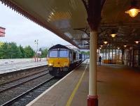 Scene at Aviemore following a shower of rain on the morning of 13 September 2017. Approaching from the south is DRS 66422 with the 0504 Mossend - Inverness Tesco containers. <br><br>[Andy Furnevel 13/09/2017]