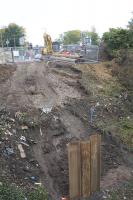 View of preparations on the north side of the railway for the construction of foundations for the temporary pedestrian and services bridge.<br><br>[Colin McDonald 26/09/2017]