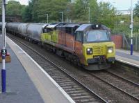 Colas Rail 70802 passes Dalgety Bay station with the Aberdeen to Oxwellmains cement empties on 14 September 2017.<br>
<br>
<br><br>[Bill Roberton 15/09/2017]