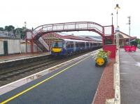 View north through a wet Aviemore station on 13 September 2017 as the ScotRail 0845 Inverness - Glasgow Queen Street calls on its way south.<br><br>[Andy Furnevel 13/09/2017]