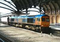 GBRf 66730, carrying the name <I>'Whitemoor'</I>, comes out of the sun and enters the cavern of York station from the south on 4 June 2013. The train is the 11.28 ex-Doncaster Decoy Yard bound for Tyne Coal Terminal.<br><br>[John Furnevel 04/06/2013]