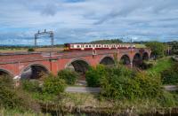 An ex-Neilston 314 216 heads east across the Waukmill Glen Viaduct. For a similar view in 1956 [see image 49884]. Viaducts along the length of the former Lanarkshire and Ayrshire vary in construction technique as it was built in portions over several years.<br><br>[Ewan Crawford 14/09/2017]