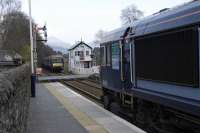 66-426 waits to cross 170-393 at Blair Atholl. <br><br>[Ian Millar 16/04/2009]