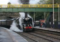 The first revenue earning train for 35018 <I>British India Line</I> was the annual <I>Lune Rivers Trust</I> special from Carnforth to York on 30th September 2017. The train is seen calling at Wennington with the loco wreathed in steam, which hid the new BR Lined Green paintwork. Unfortunately the loco was failed at the NRM with a middle big end problem and replaced by 45699 <I>Galatea</I> for the return trip.<br><br>[Mark Bartlett 30/09/2017]