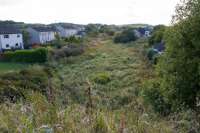 With the buffer at Neilston at my back this is the view towards Uplawmoor showing the disused trackbed. This was still easily walkable for miles in the 1980s, looks trickier now.<br><br>[Ewan Crawford 14/09/2017]