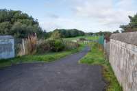 Standing on a bridge over Blacklands Junction looking north. In the middle distance is a bridge over the former Kilwinning East - Ardrossan line, with the cutting now infilled.<br><br>[Ewan Crawford 14/09/2017]