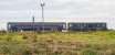 On tour. 5Z74; a sleeper coach and 73970 en route from Kilmarnock Works to Polmadie. View looking west. The floodlighting is for a recycling centre.<br><br>[Ewan Crawford 17/08/2017]