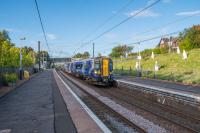 A non stop service comes south through Dalry. Off to the right some hares are having a party.<br><br>[Ewan Crawford 14/09/2017]
