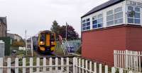 Elgin West signal box will be demolished tonight (6th-7th) after the last ballast train at 0030. One of the last exchanges at the box is shown as 158 711 heads west.<br><br>[Crinan Dunbar 06/10/2017]