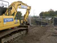 Preparations for the installation of the temporary pedestrian and services bridge, just east of the weak overbridge which is being replaced.<br><br>[Colin McDonald 26/09/2017]