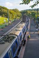 Passengers board a northbound 380 in bright evening light.<br><br>[Ewan Crawford 14/09/2017]