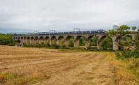 A westbound train crossing the Avon Viaduct, Linlithgow. Wires up and looking ready for electric trains. View looks south.<br><br>[Ewan Crawford 08/10/2017]