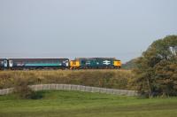 37403 <I>Isle of Mull</I> is in the autumn sunshine as it propels 2C32 Carlisle to Preston over the embankment at Bay Horse on 26th September 2017.  <br><br>[Mark Bartlett 26/09/2017]