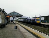 A Scotrail Class 170 waits to return to Edinburgh from Inverurie on 26 September 2017. Meanwhile an Inverness bound service is awaited on the near platform. The 'outer' platform is only used when trains need to pass.<br>
<br>
<br><br>[David Panton 26/09/2017]