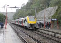 SNCB EMU 08544 leads a six-car set calling at Anseremme station on 8th September 2017. The large number of passengers had just left the nearby River Lesse kayaking centre. Twenty years earlier, and prior to electrification, this train would have been a diesel loco and coaches in push-pull mode but the kayakers would still have been be waiting to board. <br><br>[Mark Bartlett 08/09/2017]