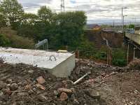 View through the site fence south over the completed foundations for the temporary pedestrian and services bridge. The piling (centre left) marks the position where the north embankment raft will have a supporting tower on top. The road bridge will presently be closed for  a few weeks to allow construction of the temporary  bridge structure.<br><br>[Colin McDonald 10/10/2017]