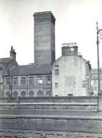 View north across the platforms at St Enoch on 23 March 1957, showing the tall ventilation shaft on the route between Glasgow Central Low Level and Glasgow Cross stations. <br><br>[G H Robin collection by courtesy of the Mitchell Library, Glasgow 23/03/1957]