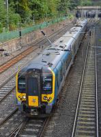 A TPE class 350 passes through Princes Street Gardens with the 12.12 from Edinburgh to Manchester Airport on 26th September 2017.<br>
<br>
<br><br>[Bill Roberton 26/09/2017]