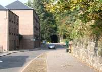 Looking west towards Auchendinny Tunnel in 2017 along the trackbed of the Penicuik Railway. The branch from Hardengreen Junction closed in 1967 and the route is now a walkway. The new housing built on this particular site stands on land previously occupied by the rail served Dalmore Paper Mill, which ceased production in 2004. Photographed from near the location of the former signal box [see image 58665].<br><br>[John Furnevel 27/09/2017]