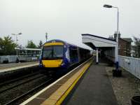 A sea mist obliterates the hills as a Glasgow train calls at 'Steenhive'<br>
on  26 September 2017. The lack of symmetry caused by the demolition of platform<br>
buildings seems particularly felt here.<br>
<br>
<br><br>[David Panton 26/09/2017]