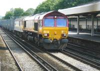 View from a northbound service standing alongside platform 2 at Redhill station on 13 July 2002. A lengthy train of containers, ultimately destined for the Channel Tunnel, is  approaching on the centre road, double headed by 66007 and 92008 <I>Jules Verne</I>.<br><br>[Ian Dinmore 13/07/2002]