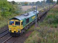 Freightliner 66554 climbs towards Ravelrig with a Grantshouse - Carlisle train of recovered track panels on 30th September 2017.<br>
<br>
<br><br>[Bill Roberton 30/09/2017]