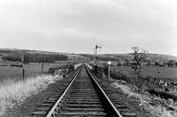 A view eastwards towards the WCML from just outside Garstang Town station before final closure. In the foreground is the bridge over the River Wyre. This was demolished after closure but later another bridge was built in connection with water treatment and flood control facilities. [See image 28295] for a similar but 21st Century view. <br><br>[Knott End Collection //]