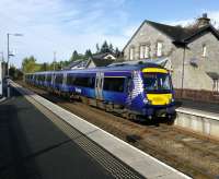 A southbound service pulls into the clean autumnal air of Blair Atholl on 4th October 2017. Unusually the station lacks departure information - a step back in<br>
time.<br>
<br>
<br><br>[David Panton 04/10/2017]