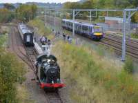 The Furness Railway Trust's GWR 0-6-2T 5643 is a guest at the Bo'ness & Kinneil Railway and scheduled to operate during the Steam Gala on 20-23 October 2017. Seen here running round the 10.45 from Bo'ness at Manuel on 14th October 2017 with 170395 passing on the E&G main line.<br>
<br>
<br><br>[Bill Roberton 14/10/2017]