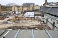 View from Cathedral Street over the former car park in early October 2017. The cabins which will serve as temporary accommodation for Scotrail staff now continue clockwise round the corner from the east side of the station; the roofs of those most recently installed can be seen in the foreground.<br>
The site offices are in the centre.<br><br>[Colin McDonald 06/10/2017]