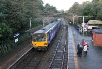 First train of the day at Wennington on 30th September 2017 as 144021 leaves for Lancaster. Wennington would normally be very quiet at this time but the Lune Rivers Trust excursion to York behind 35018 <I>British India Line</I> was scheduled in fifteen minutes, hence there were a number of passengers, and enthusiasts, on the platforms. <br><br>[Mark Bartlett 30/09/2017]