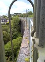 The Heads of Valleys road has destroyed or hidden much of the trackbed of the former LNWR Heads of Valleys railway; but occasional relics remain. I suspect that Nantybwch viaduct - here seen looking West through some recent artistic additions - was saved not for its own merits, but because of the number of houses which would have had to be demolished to build the road; which now passes South (to the left) of this view. [see image 60980]<br><br>[Ken Strachan 19/08/2017]