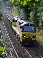 Not something you see every day.  Colas 70804 and 60021 climb away from Dalgety Bay / pass the site of Donibristle siding, with a Millerhill - Elgin ballast on 16 September.<br><br>[Bill Roberton 16/09/2017]