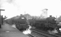 Looking back aiong platform 1 at Carlisle on Saturday 4 July 1964, where Jubilee 45627 <I>Sierra Leone</I> has recently arrived with the 8.50am Blackpool Central - Glasgow Central. Meantime Black 5 45228 awaits the call on the right.<br><br>[K A Gray 04/07/1964]