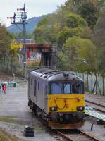 Caledonian Sleeper 73970 stabled in the oil depot sidings at Fort William.  In the background are the home signals for the junction and the bridge which carried the Lochaber Narrow Gauge Railway to the jetty on Loch Linnhe.<br><br>[Bill Roberton 20/10/2017]