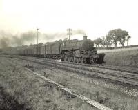 BR Standard class 5 4-6-0 no 73057 hurries past Busby Junction on 8 September 1956 with a Glasgow bound freight. [Ref query 24 October 2017]  <br><br>[G H Robin collection by courtesy of the Mitchell Library, Glasgow 08/09/1956]